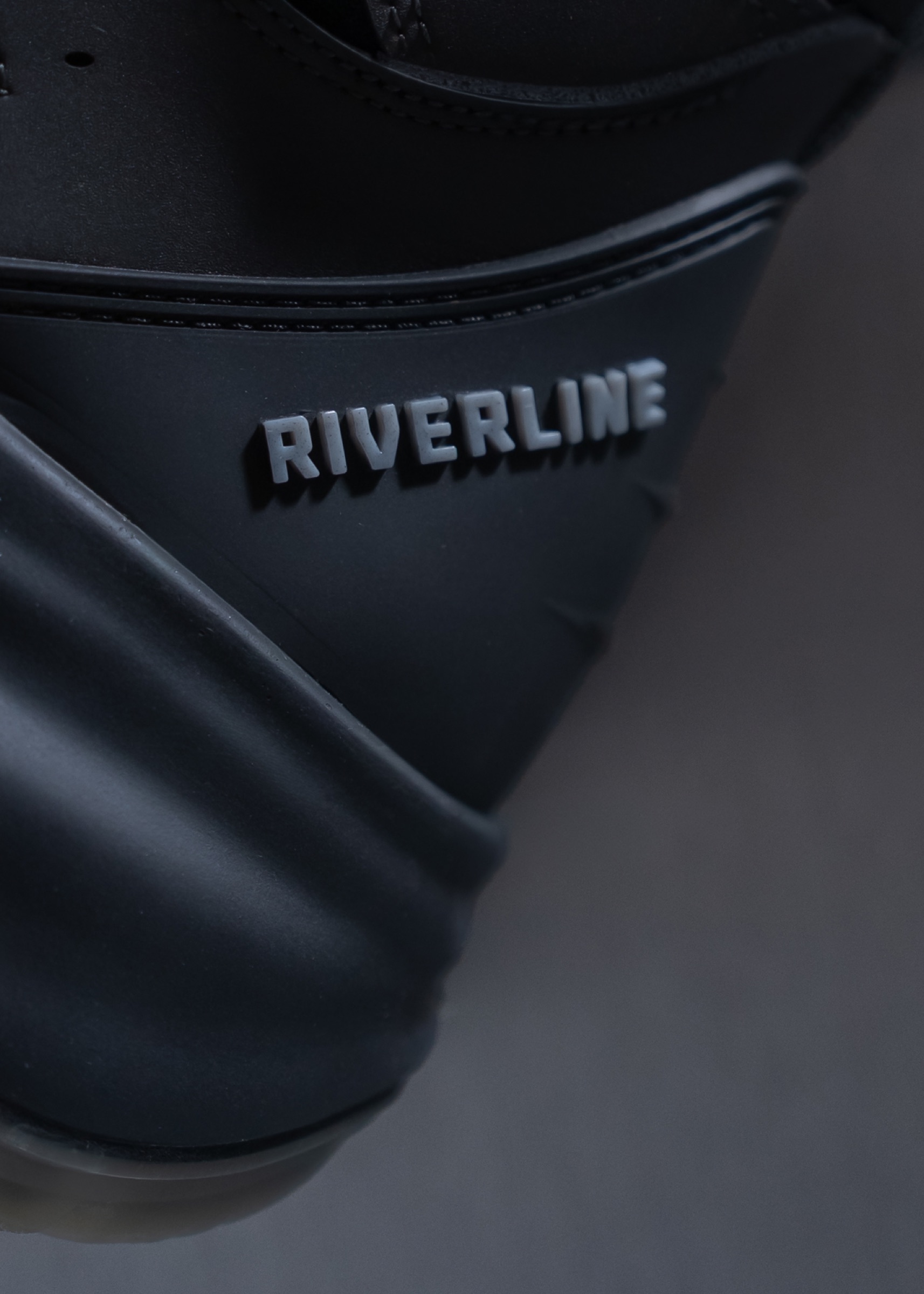 Close-up of the Riverline mark on a boot